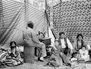 CROW FAMILY, c1906. A Crow family inside their tipi. Photograph by T.A. Morris, c1906 CROW FAMILY, c1906. A Crow family inside their tipi. Photograph by T.A. Morris, c1906