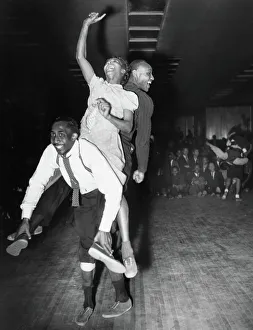 Three dancers dancing the Harlem conga, a blend of the lindy hop, conga and the Australian kangaroo hop Three dancers dancing the Harlem conga, a blend of the lindy hop, conga and the Australian kangaroo hop