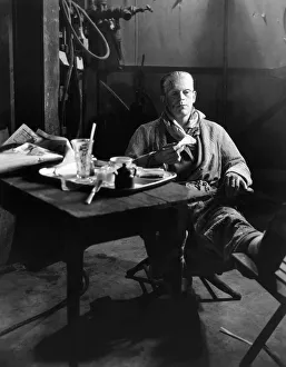 FRANKENSTEIN, 1931. Boris Karloff still in makeup as the Monster, having lunch on the stage set of Frankenstein, 1931 FRANKENSTEIN, 1931. Boris Karloff still in makeup as the Monster, having lunch on the stage set of Frankenstein, 1931