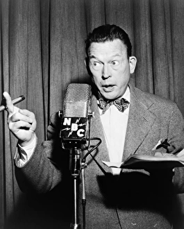 FRED ALLEN (1894-1956). American comedian and actor. Performing into a NBC microphone FRED ALLEN (1894-1956). American comedian and actor. Performing into a NBC microphone
