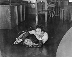 HARRY HOUDINI (1874-1926). American magician. Houdini overpowers Eugene Pallette in Terror Island, 1920 HARRY HOUDINI (1874-1926). American magician. Houdini overpowers Eugene Pallette in Terror Island, 1920