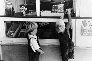 IDAHO: CHILDREN, 1941. Young boys buying candy, Caldwell, Idaho. Photograph by Russell Lee IDAHO: CHILDREN, 1941. Young boys buying candy, Caldwell, Idaho. Photograph by Russell Lee