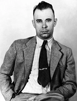 JOHN DILLINGER (1903-1934). American bank robber. Photographed in 1933 JOHN DILLINGER (1903-1934). American bank robber. Photographed in 1933