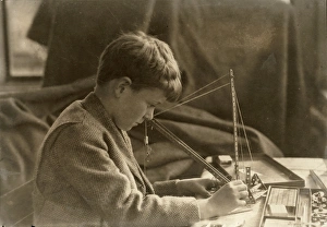 MECHANICAL TOY, c1924. A boy playing with mechanical toy. Photograph by Lewis Hine MECHANICAL TOY, c1924. A boy playing with mechanical toy. Photograph by Lewis Hine