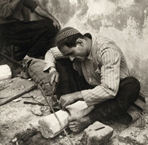 PALESTINE: METAL WORKER. A metal worker in Nazareth, Palestine, cutting teeth on a sickle PALESTINE: METAL WORKER. A metal worker in Nazareth, Palestine, cutting teeth on a sickle