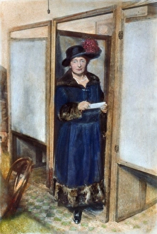 An unidentified woman with her ballot at a voting booth in New York City An unidentified woman with her ballot at a voting booth in New York City