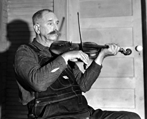 VIRGINIA: FIDDLER, 1934. Davy Crockett Ward, a fiddler with the Bog Trotters Band VIRGINIA: FIDDLER, 1934. Davy Crockett Ward, a fiddler with the Bog Trotters Band