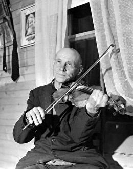 VIRGINIA: FIDDLER, 1937. Alex Dunford, a fiddler with the Bog Trotters Band, photographed VIRGINIA: FIDDLER, 1937. Alex Dunford, a fiddler with the Bog Trotters Band, photographed