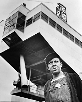 WATTS BAR DAM, 1942. Earl Tulloss, a dragline operator employed by the Tennessee WATTS BAR DAM, 1942. Earl Tulloss, a dragline operator employed by the Tennessee