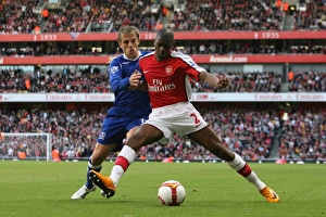 Abu Diaby (Arsenal) Phil Neville (Everton) Abu Diaby (Arsenal) Phil Neville (Everton)