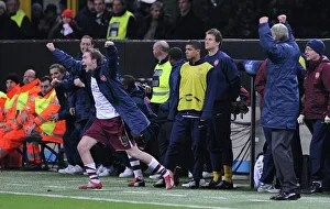 Alex Hleb and the Arsenal bench celebrate at the final whistle Alex Hleb and the Arsenal bench celebrate at the final whistle
