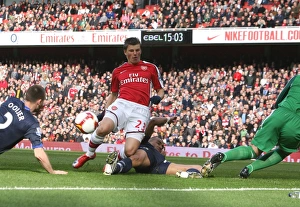 Andrey Arshavin looks on as Andre Ooijer puts through Andrey Arshavin looks on as Andre Ooijer puts through