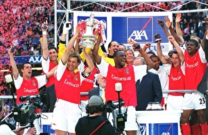 Arsenal captain Tony Adams and vice-captain Patrick Vieira lift the FA Cup Arsenal captain Tony Adams and vice-captain Patrick Vieira lift the FA Cup