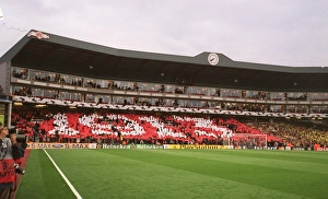 Arsenal fans in the Clock End hold up cards that read 1913 Arsenal fans in the Clock End hold up cards that read 1913