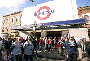 Arsenal fans walk outside Arsenal Tube Station before the match Arsenal fans walk outside Arsenal Tube Station before the match
