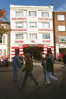 Arsenal fans walk outside the entrance to the West Stand Upper before the match Arsenal fans walk outside the entrance to the West Stand Upper before the match