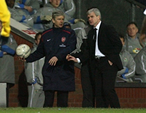 Arsenal manager Arsene Wenger with Blackburn Rovers manager Mark Hughes Arsenal manager Arsene Wenger with Blackburn Rovers manager Mark Hughes
