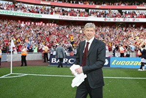 Arsenal manager Arsene Wenger waves to the fans after the match Arsenal manager Arsene Wenger waves to the fans after the match