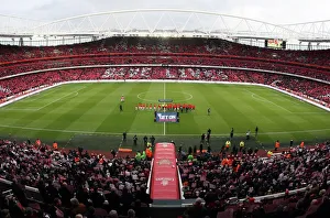 Arsenal and Manchester United shakes hands as the fans hold up Lace Up Save Lives cards Arsenal and Manchester United shakes hands as the fans hold up Lace Up Save Lives cards