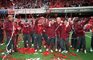 The Arsenal players catch up in the streamers. Arsenal 4:2 Wigan Athletic The Arsenal players catch up in the streamers. Arsenal 4:2 Wigan Athletic