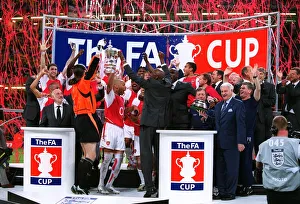 The Arsenal players celebrate lifting the FA Cup Trophy The Arsenal players celebrate lifting the FA Cup Trophy