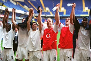 Arsenal players celebrate winning the League (L>R) Lauren, Robert Pires Arsenal players celebrate winning the League (L>R) Lauren, Robert Pires