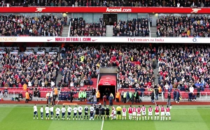 Arsenal players shake hands with the Tottenham team before the match Arsenal players shake hands with the Tottenham team before the match