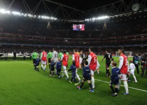 The Arsenal players walk out onto the pitch before the match. Arsenal 3:0 AC Milan The Arsenal players walk out onto the pitch before the match. Arsenal 3:0 AC Milan