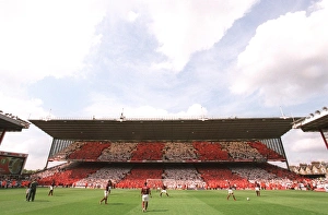 The Arsenal players warm up in front of the North Bank The Arsenal players warm up in front of the North Bank