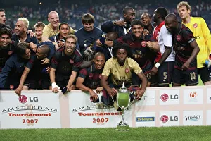 The Arsenal team celebrate winning the Amsterdam tournament The Arsenal team celebrate winning the Amsterdam tournament