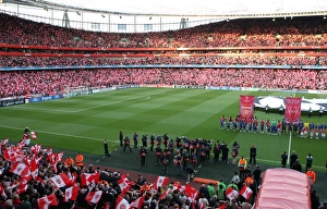 The Arsenal team line ups before the match as the fans The Arsenal team line ups before the match as the fans
