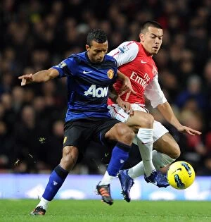 Images Dated 22nd January 2012: Arsenal vs Manchester United: Nico Yennaris Tackles Nani in Intense Premier League Clash
