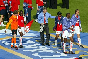 Arsene Wenger the Arsenal Managertalks to Ashley Cole at the end of the match Arsene Wenger the Arsenal Managertalks to Ashley Cole at the end of the match