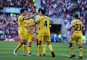 Cesc Fabregas celebrates scoring the Arsenal goal with Samir Nasri, Marouane Chamakh Cesc Fabregas celebrates scoring the Arsenal goal with Samir Nasri, Marouane Chamakh