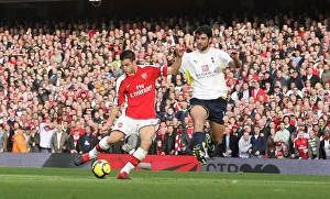 Cesc Fabregas shoots past Tottenham goalkeeper Heurelho Cesc Fabregas shoots past Tottenham goalkeeper Heurelho