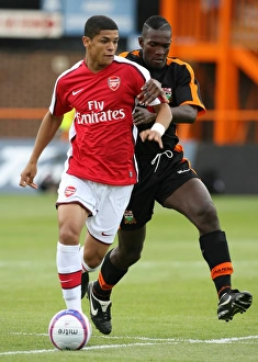 Denilson (Arsenal) Cliff Akurang (Barnet) Denilson (Arsenal) Cliff Akurang (Barnet)