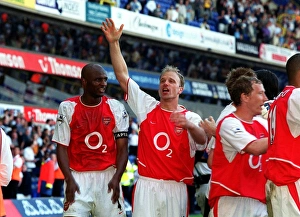 Dennis Bergkamp and Patrick Vieira celebrate winning the league Dennis Bergkamp and Patrick Vieira celebrate winning the league