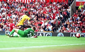 Emmanuel Adebayor shoots past Manchester United goalkeeper Tomaz Kuszczak to score Emmanuel Adebayor shoots past Manchester United goalkeeper Tomaz Kuszczak to score