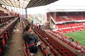 Fans sit in the North Bank as Arsenal Stadium empties after the match and Final Salute Events Fans sit in the North Bank as Arsenal Stadium empties after the match and Final Salute Events