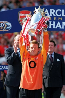 Graham Stack (Arsenal) lifts the Premiership Trophy. Arsenal v Leicester City Graham Stack (Arsenal) lifts the Premiership Trophy. Arsenal v Leicester City