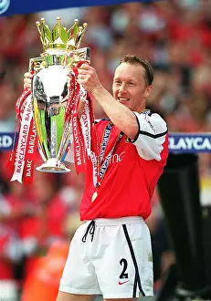 Lee Dixon lifts the Premiership trophy after the match. Arsenal 4:3 Everton, F Lee Dixon lifts the Premiership trophy after the match. Arsenal 4:3 Everton, F