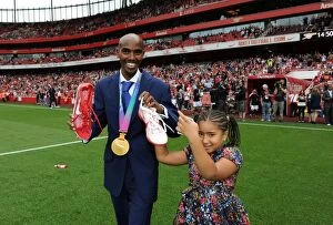 Images Dated 10th September 2011: Mo Farah, Arsenal Supporter and 5000m World Champion, Celebrates Victory at Emirates Stadium as