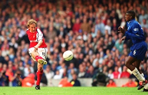 Ray Parlour shoots past Chelsea defender Marcel Desailly to score the 1st Arsenal goal Ray Parlour shoots past Chelsea defender Marcel Desailly to score the 1st Arsenal goal