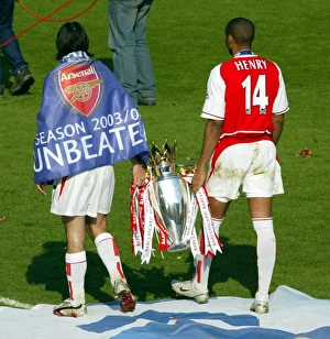 Robert Pires and Thierry Henry with the Premiership trophy Robert Pires and Thierry Henry with the Premiership trophy