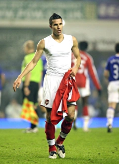 Robin van Persie goes to throw his shirt to the Arsenal Robin van Persie goes to throw his shirt to the Arsenal