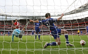 Robin van Persie heads past Tim Howard and Leighton Robin van Persie heads past Tim Howard and Leighton