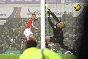 Robin van Persie shoots past Everton goalkeeper Tim Robin van Persie shoots past Everton goalkeeper Tim