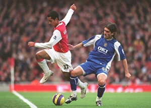 Theo Walcott (Arsenal) Pedro Mendes (Portsmouth) Theo Walcott (Arsenal) Pedro Mendes (Portsmouth)