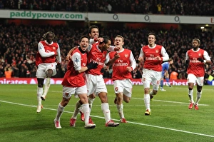 Theo Walcott celebrates scoring Arsenals 3rd goal with his team mates Theo Walcott celebrates scoring Arsenals 3rd goal with his team mates