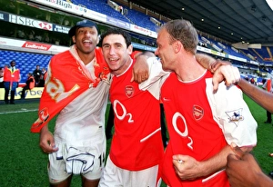 Thierry Henry, Martin Keown and Dennis Bergkamp (Arsenal) celebrate winning the league Thierry Henry, Martin Keown and Dennis Bergkamp (Arsenal) celebrate winning the league